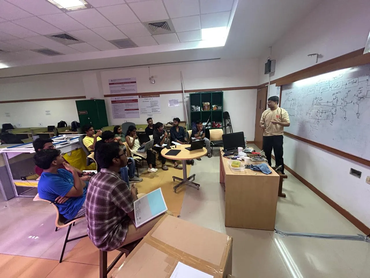 Interns at a design briefing in the Manipal workshop